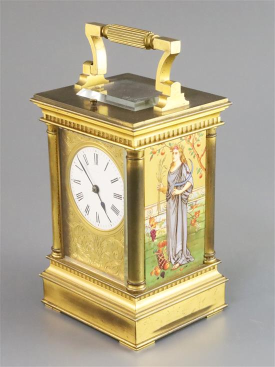 An Edwardian ormolu and porcelain hour repeating carriage clock, height 6.75in., with brown leather travelling case